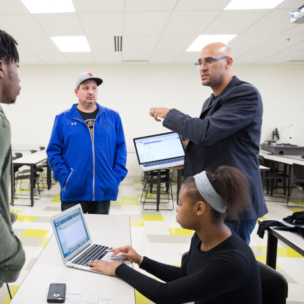 Louis Moore (right), associate professor of history, will kick off Black History Month February 1.