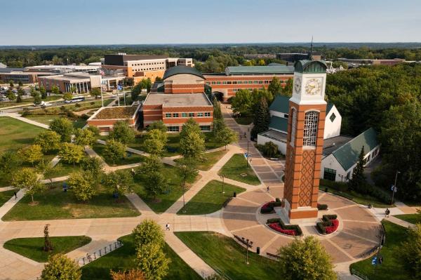 Drone photo of Allendale campus with clock tower at center and lots of sidewalks