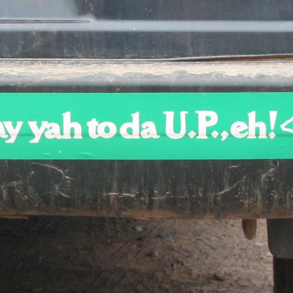 A green bumper sticker says, "Say yah to da U.P., eh!"