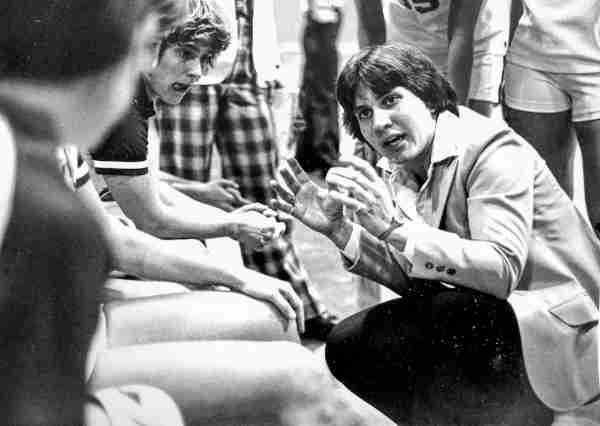 Former women's basketball coach Pat Baker-Grzyb talks with players