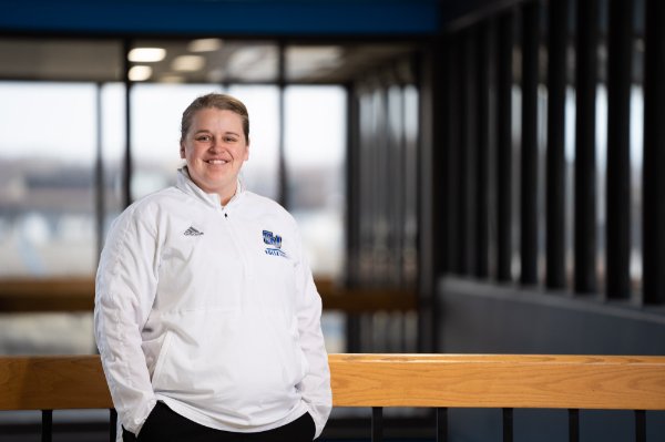 Assistant volleyball coach Callie Youngman poses for a photo