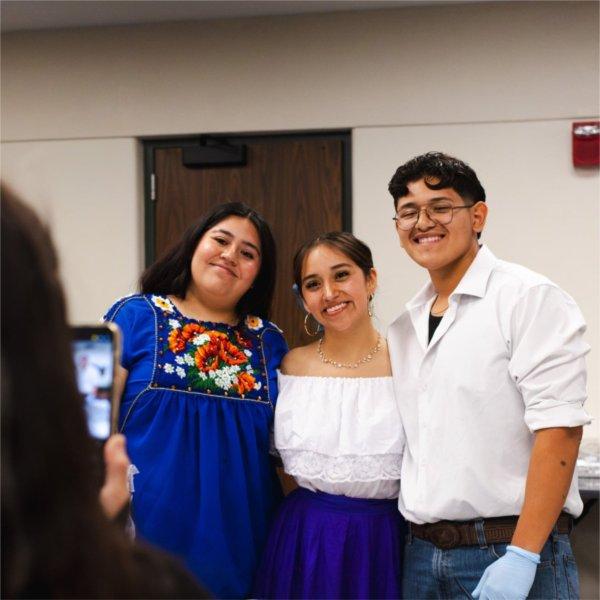 Three GVSU students pose together for a picture during the Hispanic Heritage Celebration.