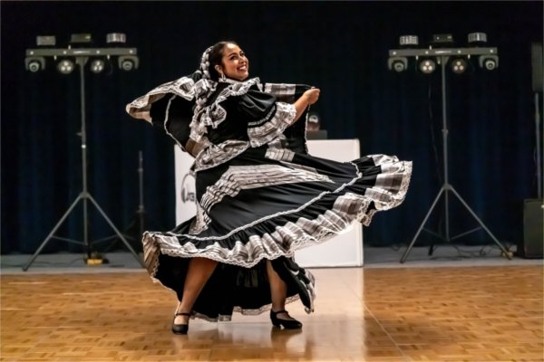 Dancer Carissa Lugo performs in a black traditional folkloric dress from the Jalisco region of Mexico