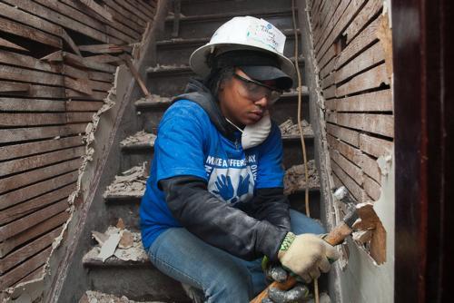 Tiffany Jones gets her hands dirty during a project during Make A Difference Day 2011.