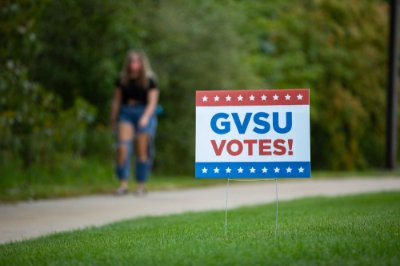 A red, white and blue sign with stars that reads GVSU Votes&amp;&#x23;x21&#x3b;