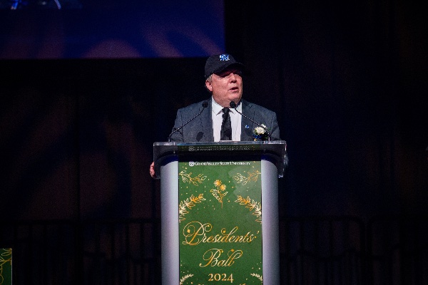 Andy Beachnau, assistant vice president for student affairs, on stage at the Presidents' Ball.