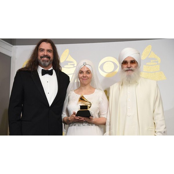 The band White Sun at the 2023 Grammy Awards. The lead singer, Gurujas, is wearing a dress designed by GVSU alumna, Ashley Trieu, '11.