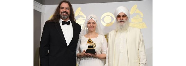 The band White Sun at the 2023 Grammy Awards. The lead singer, Gurujas, wears a dress designed by GVSU alumna, Ashley Trieu, '11.