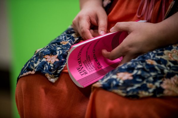An actor holding a book of lines.