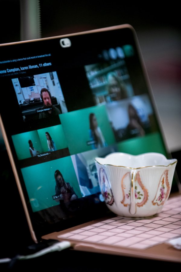 Actors are seen on a laptop during play rehearsal in front of a webcam and green screen for the upcoming production of "The Revolutionists." The teacup is a prop used in the play.
