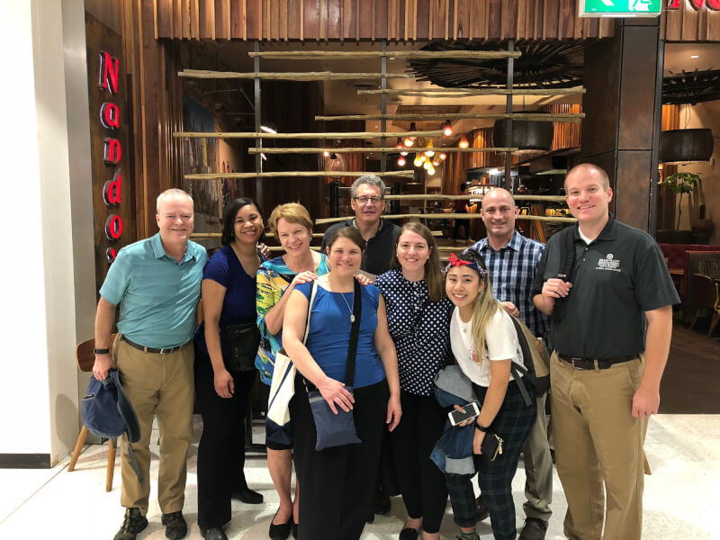 group of people in front of restaurant