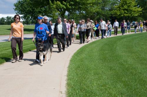 Participants in a Farmers Market walk are pictured. Exercising regularly is among the options participants can track in the Healthy Choices program.