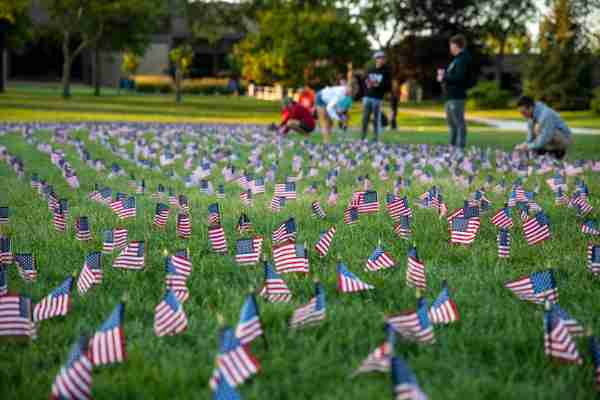 Students placing U.S. flags in remembrance of September 11