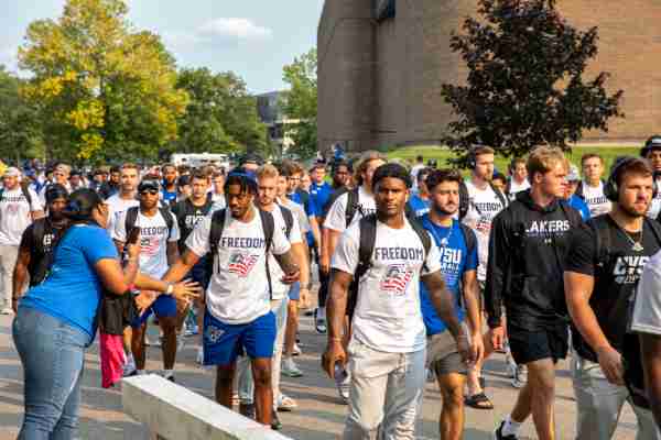 The Grand Valley football team walks to Lubbers Stadium before its games