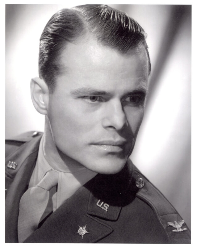 A historic portrait of Ralph W. Hauenstein, posing in his military uniform.