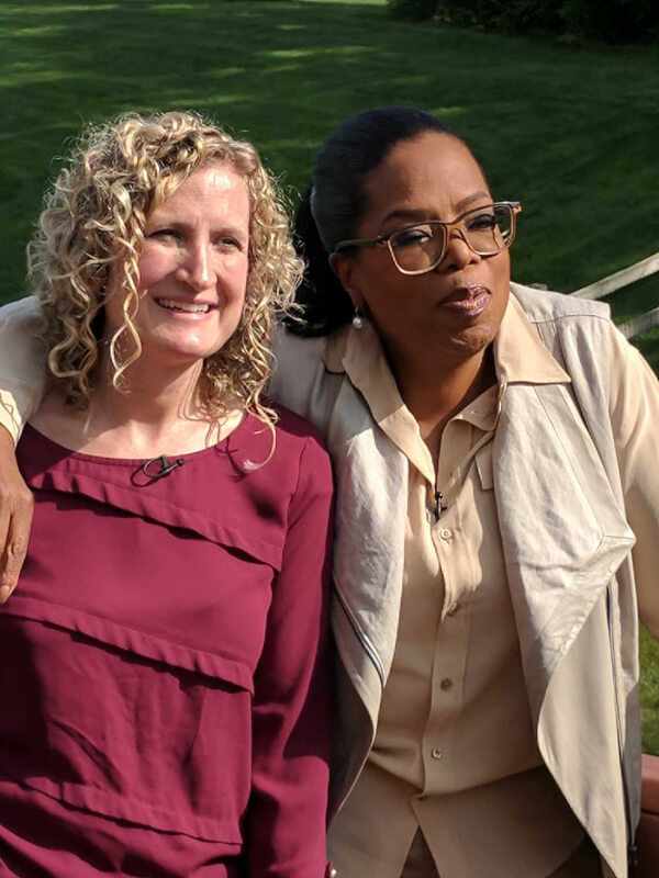two women standing on deck