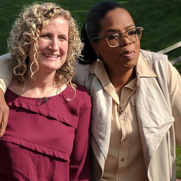two women standing on deck