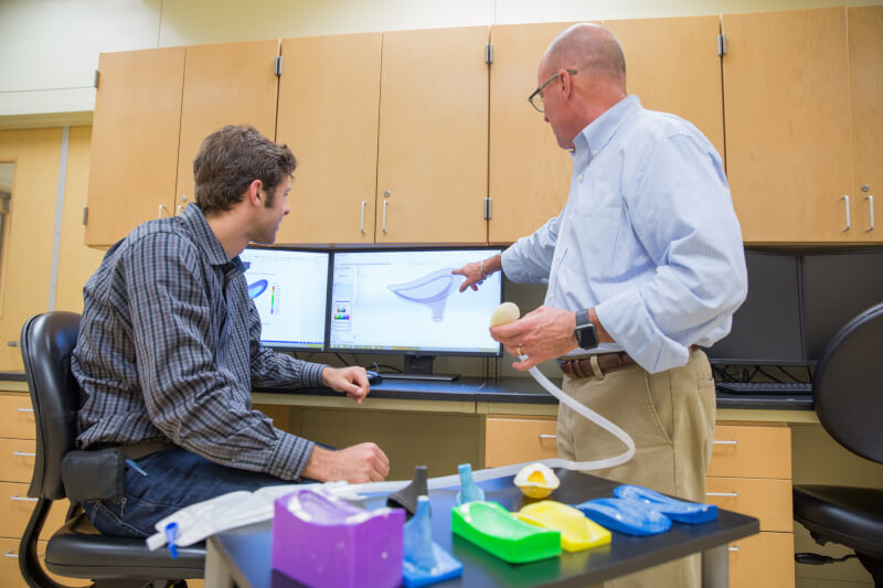 The aMDI team includes Kevin Weaver, left; Brent Nowak, right; and a team of graduate and undergraduate students.