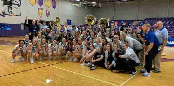 The Grand Valley women's basketball team celebrates winning the regional championship.