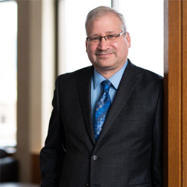 Portrait of Paul Isely, associate dean and professor of economics at GVSU's Seidman College of Business