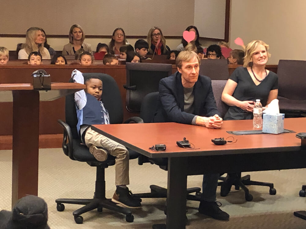 Michael, David Eaton and Andrea Melvin during the adoption hearing.