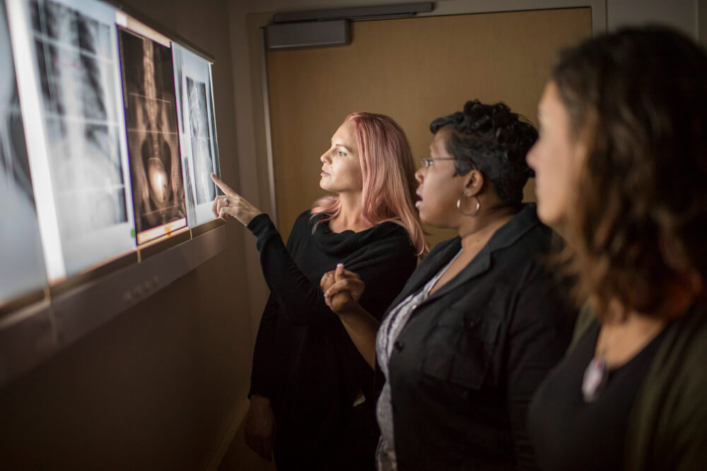 women looking at x-ray