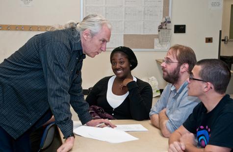Max Bush works with students on a new play