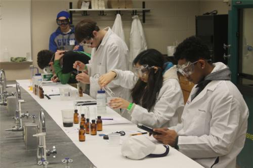 A team of students preparing to make cheese curds. Photo by John Meyers.