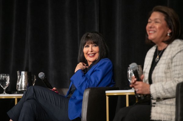 President Philomena V. Mantella smiles during a response by a panel member during a forum discussion hosted by the Economic Club of Grand Rapids.