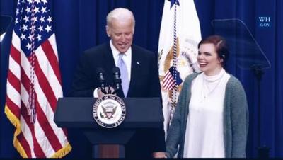 Malayna Hasmanis accepts an award from Vice President Joe Biden