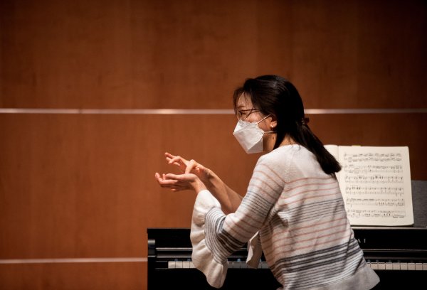 Sookkyung Cho works with a piano student.