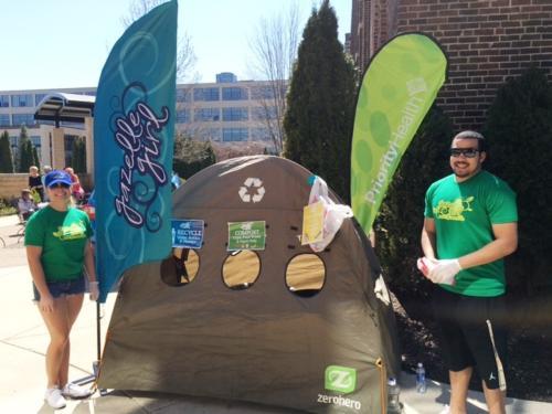 Caity Hamaker and Julian Jarrett are pictured at the April 17 Gazelle Girl Half Marathon race, helping to facilitate a zero-waste event.
