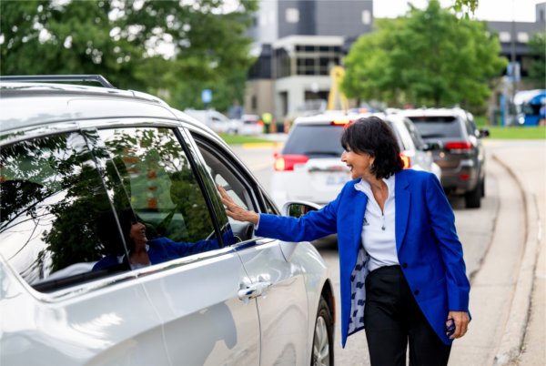 President Philomena V. Mantella greets a student awaiting to check in during Move-In Day.