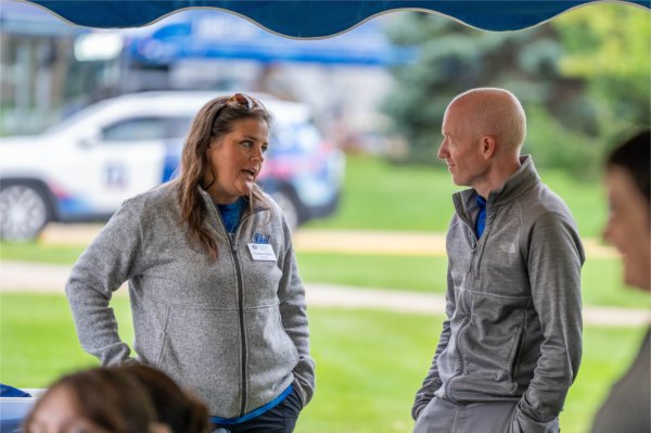 Colleen Bailey, director of Resident Life, chats with Kevin Conn, assistant vice president for Student Affairs for Housing and Residence Life, during the first day of Valley Campus move-in.
