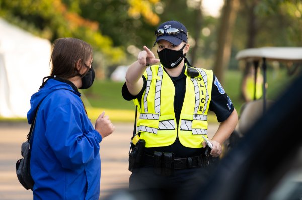 a GVPD officer directs someone with a question during move-in