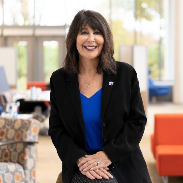 President Mantella stands in the Mary Idema Pew Library