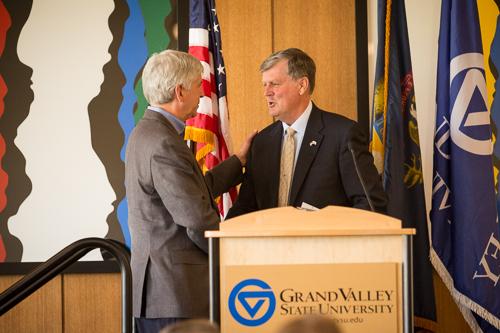 Governor Snyder shakes hands with President Haas. 