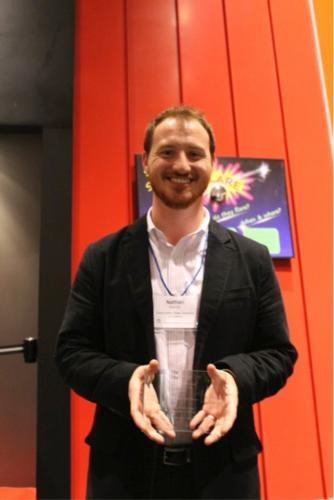 Nathan Kemler, GVSU Art Gallery collections manager, accepted the award. Photo by Rebecca Swindler