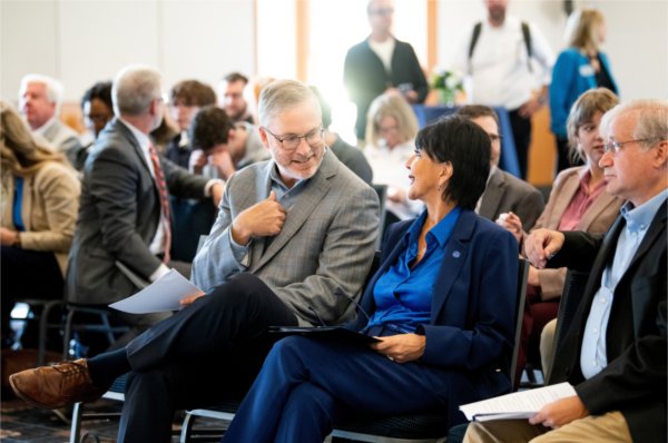 Randy Thelen, President and CEO The Right Place, left, speaks with President Philomena V. Mantella before the start of a press conference to share GVSU&#8217;s economic impact report. The press conference was held in the Seidman Forum Room inside the L. William Seidman Center on the City Campus October 2.