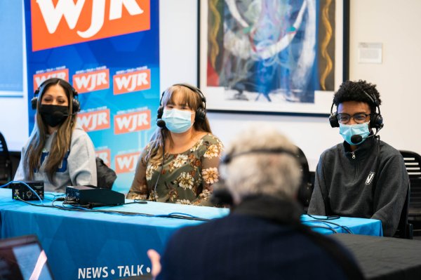 Three students being interviewed by Guy Gordon, radio host on WJR.