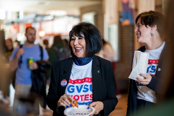 President Philomena V. Mantella laughing with students at the Popcorn at the Polls event.