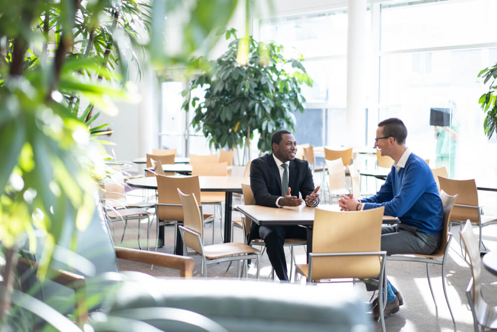 two people talking at a table