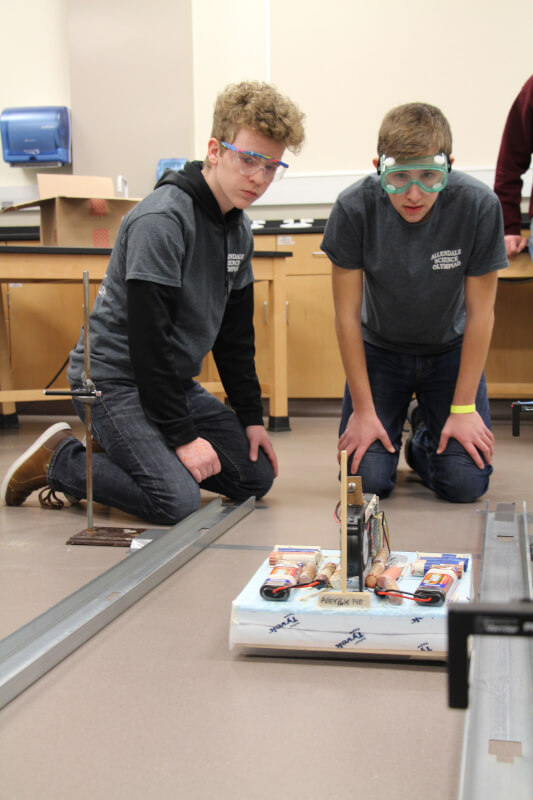 Allendale High School students watching their hovercraft move down the track.
