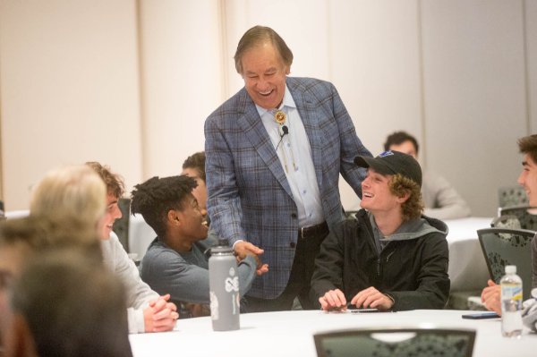 Billy Mills mingles with students at "A conversation with Billy Mills" 