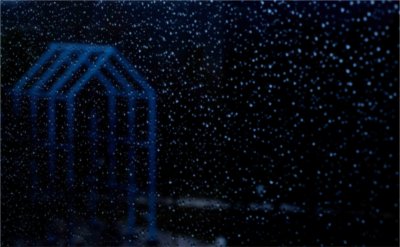 The Transformational Link is seen through raindrops on a window from James H. Zumberge Hall March 26.