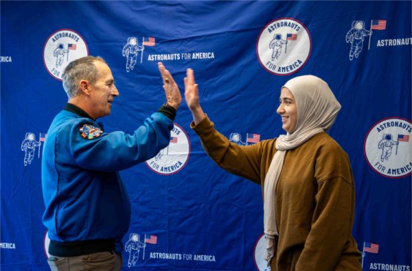  Two people high five. 