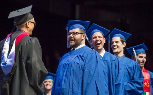 Dale Boedeker, second from left, is the 100,000th student to graduate from Grand Valley.