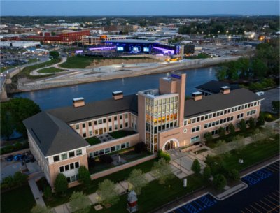 Aerial photo of L. William Seidman Center with the Grand River and the Acrisure Amphitheater in the background.