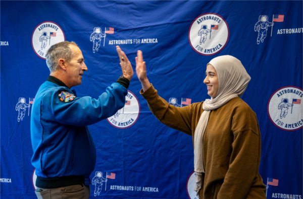 Retired U.S. Navy Commander and former NASA astronaut John Herrington talks with biomedical engineering major Cebrina Kader at the Kirkhof Center after speaking about the importance of democracy as part of Astronauts for America on the Valley Campus on September 15.