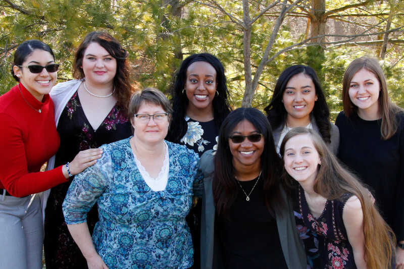 group of women standing outside